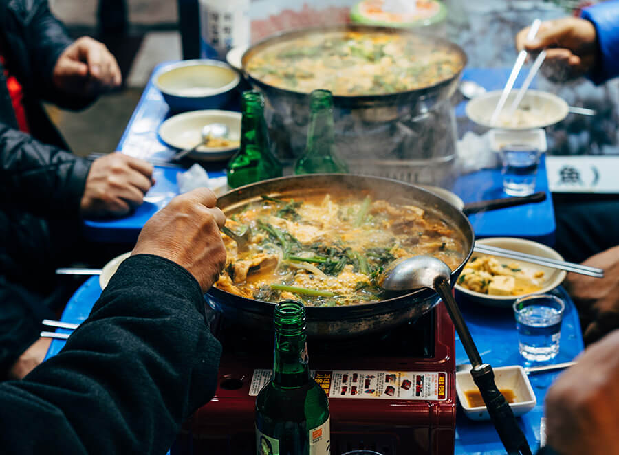 Korean people gathering enjoying a meal